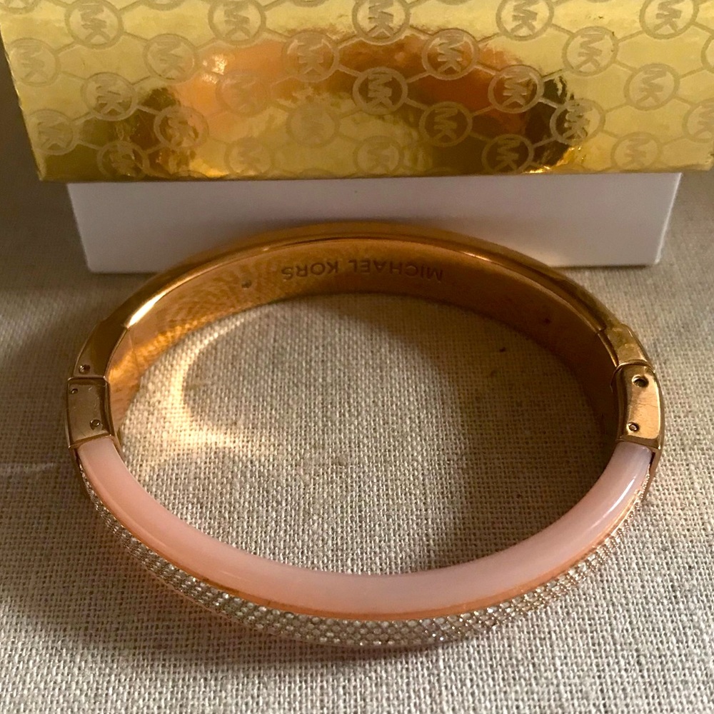 Michael Kors rose gold crystal hinge bracelet.